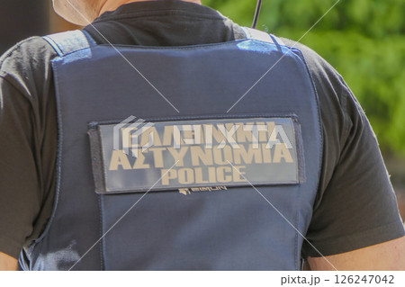 Greece, Thessaloniki, police officer with the word police on his back. Greece, Thessaloniki, police officer with the word police on his back. 126247042