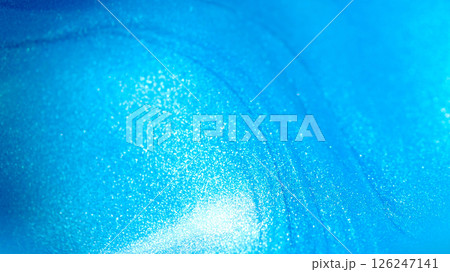 a brilliant, metallic turquoise blue surface with a high concentration of shimmer or micro-glitter a brilliant, metallic turquoise blue surface with a high concentration of shimmer or micro-glitter 126247141