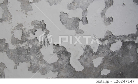 Peeling White Paint on Concrete Wall with Weathered Texture 126247147