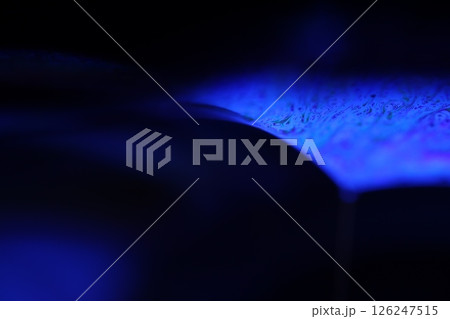 Deep purple liquid surface on black background, oil stains movement, bright chemistry, deep space background 126247515