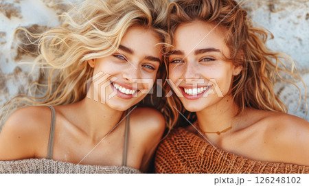 overjoyed multiethnic lesbian couple hugging and looking at each overjoyed multiethnic lesbian couple hugging and looking at each 126248102