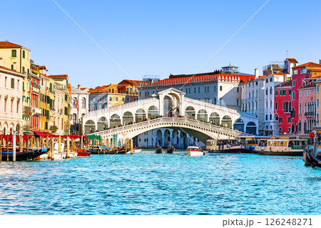 Landscape with Rialto Bridge and gondola on the Grand Canal in Venice, Italy, Europe. Landscape with Rialto Bridge and gondola on the Grand Canal in Venice, Italy, Europe. 126248271