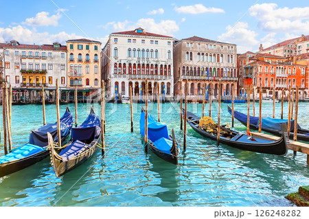 Gondolas on Grand canal in Venice, Italy. View of the beautiful Grand Canal in Venice, with palaces, gondolas and boats. 126248282