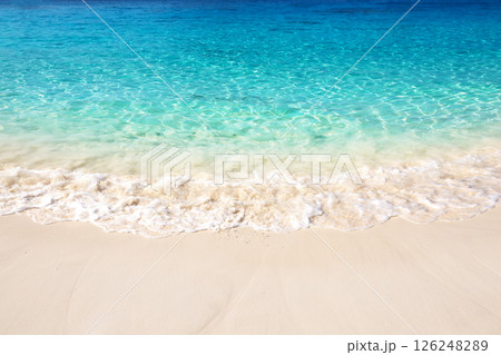 Beautiful white sand beach with turquoise water on a sunny day in Similan Islands near Phuket, Thailand. Beautiful white sand beach with turquoise water on a sunny day in Similan Islands near Phuket, Thailand. 126248289