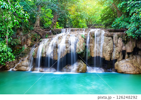 Amazing Erawan waterfall in tropical forest of national park Kanchanaburi in Thailand. Amazing Erawan waterfall in tropical forest of national park Kanchanaburi in Thailand. 126248292
