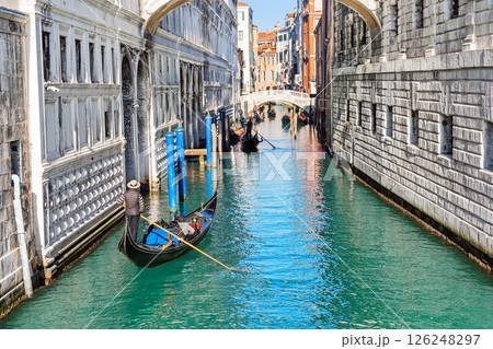 Gondolas floating under the bridge of Sighs (Ponte dei Sospiri) in Venice, Italy. 126248297