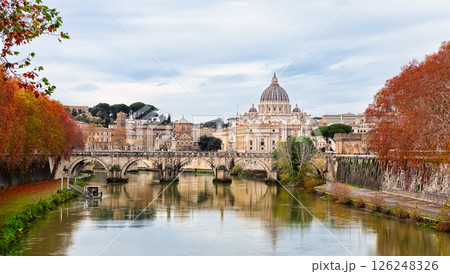 Panorama of St. Peter's Basilica, Sant Angelo bridge and Tiber river in autumn day in Rome, Italy. Autumn Italy and Vatican. Panorama of St. Peter's Basilica, Sant Angelo bridge and Tiber river in autumn day in Rome, Italy. Autumn Italy and Vatican. 126248326