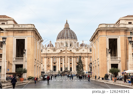 View of St. Peter's Basilica and and Saint Peter's Square in the Vatican city against cloudy sky, Rome, Italy. View of St. Peter's Basilica and and Saint Peter's Square in the Vatican city against cloudy sky, Rome, Italy. 126248341