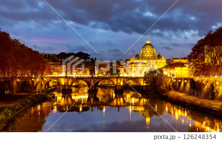 Beautiful image of St. Peter's Basilica, Ponte Sant Angelo and Tiber River at dark night in Rome, Italy. Sant' Angelo Bridge and St. Peter's cathedral at sunset in Vatican City, Rome, Italy. Beautiful image of St. Peter's Basilica, Ponte Sant Angelo and Tiber River at dark night in Rome, Italy. Sant' Angelo Bridge and St. Peter's cathedral at sunset in Vatican City, Rome, Italy. 126248354
