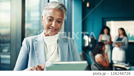 Office, mature and businesswoman with tablet for reading, news story and notification for blog post. Newsroom, female person and editor with technology for publication, article information and scroll Office, mature and businesswoman with tablet for reading, news story and notification for blog post. Newsroom, female person and editor with technology for publication, article information and scroll 126248726