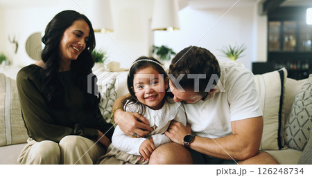 Hug, happy family and parents with girl, living room and sofa with love, bonding and relax in home. Mom, dad and child on couch with support, man and woman with daughter for weekend break or trust Hug, happy family and parents with girl, living room and sofa with love, bonding and relax in home. Mom, dad and child on couch with support, man and woman with daughter for weekend break or trust 126248734