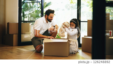 Packing, box and girl with father for moving, property relocation or smile in new home. Child, kid and dad with package for mortgage, real estate loan or help for unboxing belongings in dream house 126248892