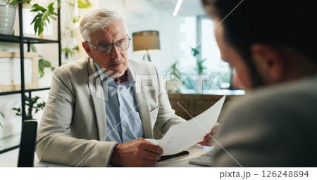 Businessman, executive and meeting with documents for corporate proposal, budget or investment at office. Man, CEO or financial advisor talking to client with paperwork for company funding or finance 126248894