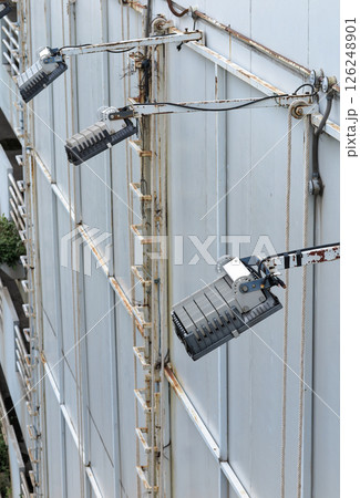 Empty outdoor billboard with spotlights. Blank zinc billboard ready for advertisement. Empty outdoor billboard with spotlights. Blank zinc billboard ready for advertisement. 126248901