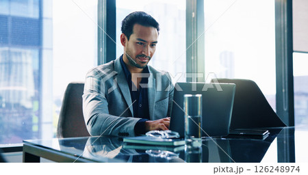 Laptop, corporate and business man typing finance report, investment portfolio and actuary reading email. Computer, internet and employee in office for risk assessment, project or research online 126248974