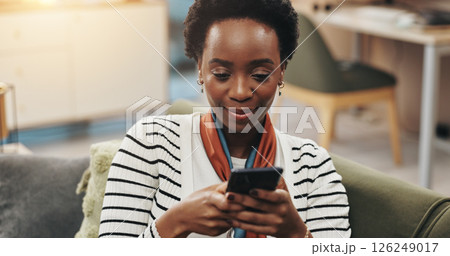 Black woman, happy and typing with phone on sofa for text message, dating site and social media scroll. Relax, person and internet connection in home for streaming service, reading ebook and research Black woman, happy and typing with phone on sofa for text message, dating site and social media scroll. Relax, person and internet connection in home for streaming service, reading ebook and research 126249017