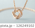 Elegant gold necklace with a pendant on light background. minimalist gold chain necklace. Luxury jewelry. 126249102