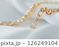 Gold chain bracelet with braided design, representing elegance, luxury, and craftsmanship. Fashion and lux jewelry and accessories. 126249104