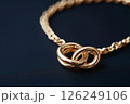 Elegant gold necklace with a pendant on light background. minimalist gold chain necklace. Luxury jewelry. 126249106