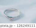 Elegant silver engagement ring with a perfectly cut gemstone, symbolizing love and luxury. A perfect representation of fine jewelry and sophistication for special occasions or treasured memories. 126249111
