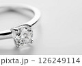 Elegant silver engagement ring with a perfectly cut gemstone, symbolizing love and luxury. A perfect representation of fine jewelry and sophistication for special occasions or treasured memories. 126249114