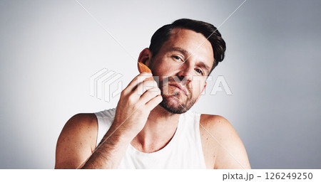 Portrait, comb and man with beard in studio for wellness, grooming and haircare on white background. Skincare, space and person with tools for facial hair, growth and styling for morning routine 126249250