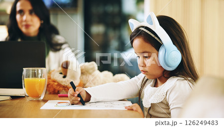 Drawing, remote work or mom with kid, homework or single parent for education or homeschool lesson. Headphones, mother and daughter colouring on paper for learning activity, student and sketching Drawing, remote work or mom with kid, homework or single parent for education or homeschool lesson. Headphones, mother and daughter colouring on paper for learning activity, student and sketching 126249483