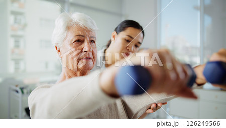 Physical therapy, dumbbell and woman with mature patient for medical service, support and wellness. Healthcare, consulting and physiotherapist with person for osteoporosis, mobility and strength 126249566