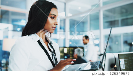 Woman, developer and reading on laptop in office of programming, coding support and server update. Person, online app and IT for testing system, website application and troubleshooting at call centre Woman, developer and reading on laptop in office of programming, coding support and server update. Person, online app and IT for testing system, website application and troubleshooting at call centre 126249675
