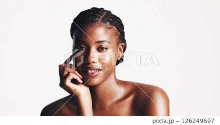 Portrait, beauty and confident black woman with makeup or aesthetics for facial glow, wellness or shine. Studio, space and proud African model with cosmetics, collagen or skincare on white background Portrait, beauty and confident black woman with makeup or aesthetics for facial glow, wellness or shine. Studio, space and proud African model with cosmetics, collagen or skincare on white background 126249697