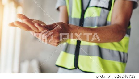Hands, construction worker and pain with carpal tunnel for renovation project, arthritis or injury at site. Person, engineer and builder with burnout, muscle fatigue or tired with massage for relief 126249715