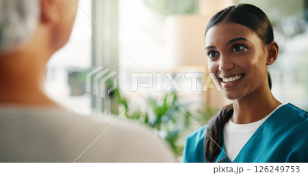 Talking, nurse and smile for senior patient, healthcare and treatment plan for illness, women and results. Happy, medical professional and diagnosis for elderly person in hospital or conversation Talking, nurse and smile for senior patient, healthcare and treatment plan for illness, women and results. Happy, medical professional and diagnosis for elderly person in hospital or conversation 126249753