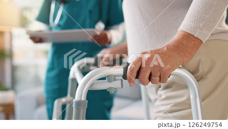 Nurse, physiotherapist or patient hands with walker for assisted living, exam or test at clinic. Closeup, medical worker or doctor helping person with a disability for mobility, movement or recovery Nurse, physiotherapist or patient hands with walker for assisted living, exam or test at clinic. Closeup, medical worker or doctor helping person with a disability for mobility, movement or recovery 126249754