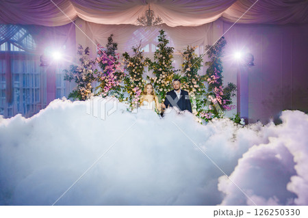 Beautiful and in love newlyweds dance with heavy smoke 126250330