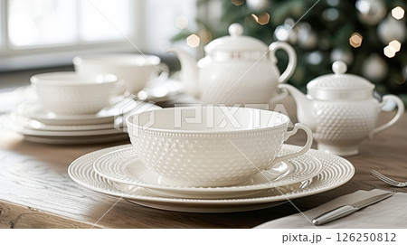 Still life served festive dinner table while Christmas lights glowing 126250812