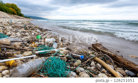 Plastic pollution of the ocean is an environmental problem. Dirty sea beach, garbage on seashore. A global problem, a threat to ocean wildlife and calling for urgent action to protect the environment. 126251051