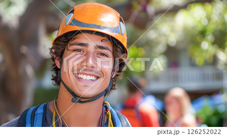 portrait of a smiling man in work clothes and a hard hat. He is a lumberjack portrait of a smiling man in work clothes and a hard hat. He is a lumberjack 126252022