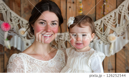 happy young beautiful woman mother with a small child in her arms hugging 126252544