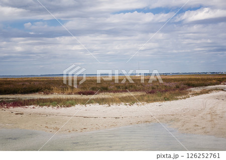picturesque summer landscape. beach with white sand, blue sea and rich sky picturesque summer landscape. beach with white sand, blue sea and rich sky 126252761
