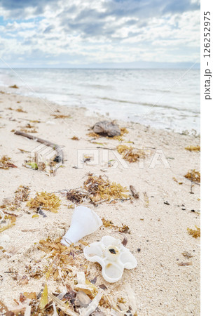 Plastic garbage on tropical beach, selective focus. Plastic garbage on tropical beach, selective focus. 126252975