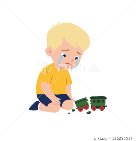 Crying sad boy in yellow shirt playing with broken green toy train vector illustration 126253517