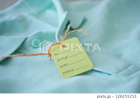 Tag on blue shirt in store 126255253