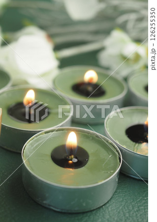 Softly flickering candles creating a calming atmosphere indoors 126255350