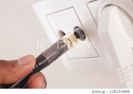 Close-Up of Cable Connection in Wall Socket for Electrical or AV Systems Close-Up of Cable Connection in Wall Socket for Electrical or AV Systems 126255606