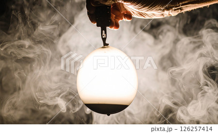 Tattoo needle puncturing a water balloon . Background concept. Generated Image 126257414