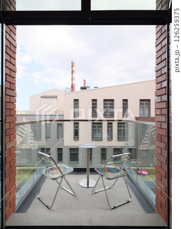 A Stunning Contemporary Balcony View with Two Chic, Comfortable Chairs for Relaxation A Stunning Contemporary Balcony View with Two Chic, Comfortable Chairs for Relaxation 126259375