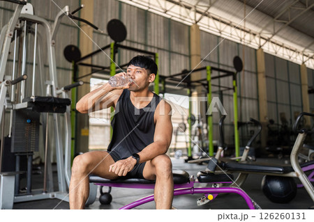 Fitness: Hydrating After Workout in Gym drink of water Fitness: Hydrating After Workout in Gym drink of water 126260131
