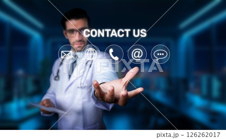 Medical Professional in White Coat Reaching Out with Contact Us Icons for Healthcare Communication Concept in Modern Office Environment. PHMT Medical Professional in White Coat Reaching Out with Contact Us Icons for Healthcare Communication Concept in Modern Office Environment. PHMT 126262017