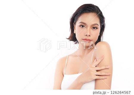 A beautiful young Asian woman with clean, fresh skin against a white background. Skincare, facial treatment, cosmetology, beauty, and spa. An elegant portrait of an Asian woman. A beautiful young Asian woman with clean, fresh skin against a white background. Skincare, facial treatment, cosmetology, beauty, and spa. An elegant portrait of an Asian woman. 126264567