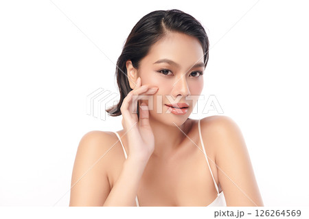 A beautiful young Asian woman with clean, fresh skin against a white background. Skincare, facial treatment, cosmetology, beauty, and spa. An elegant portrait of an Asian woman. A beautiful young Asian woman with clean, fresh skin against a white background. Skincare, facial treatment, cosmetology, beauty, and spa. An elegant portrait of an Asian woman. 126264569